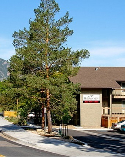Charming apartment nestled in a serene location surrounded by lush greenery and stunning mountain views.