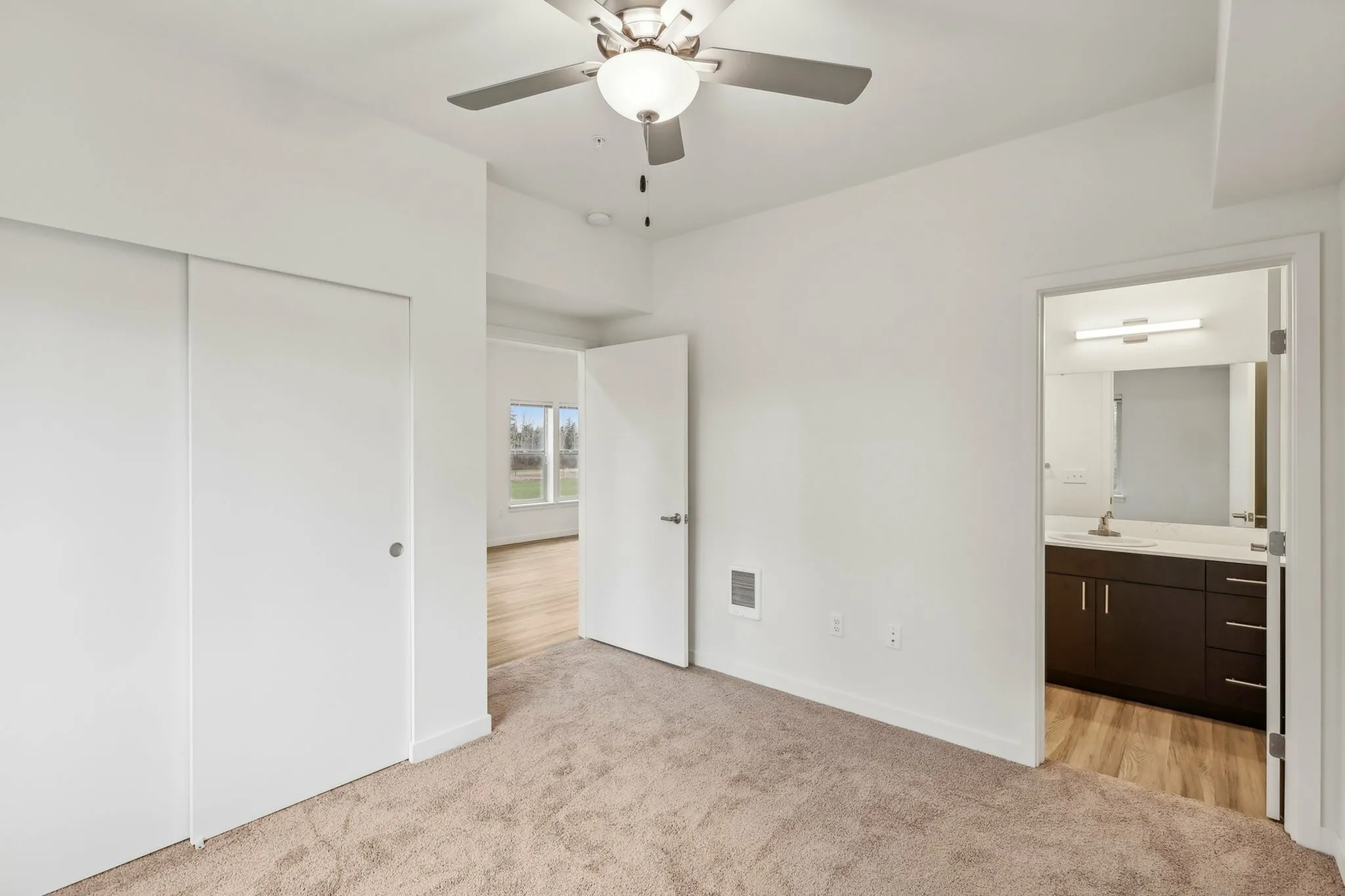 The primary bedroom features an en suite bath