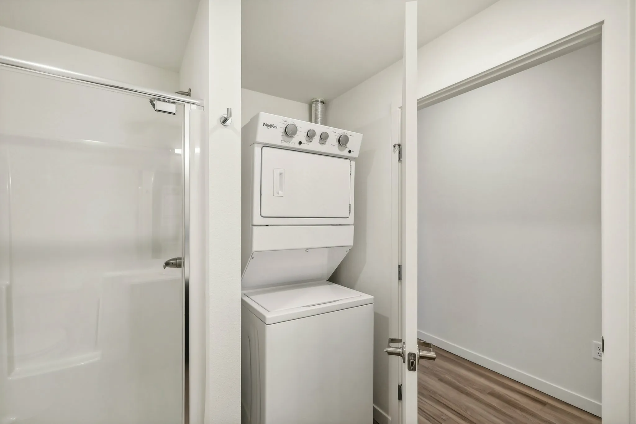 A full-size washer dryer is in the main bathroom.