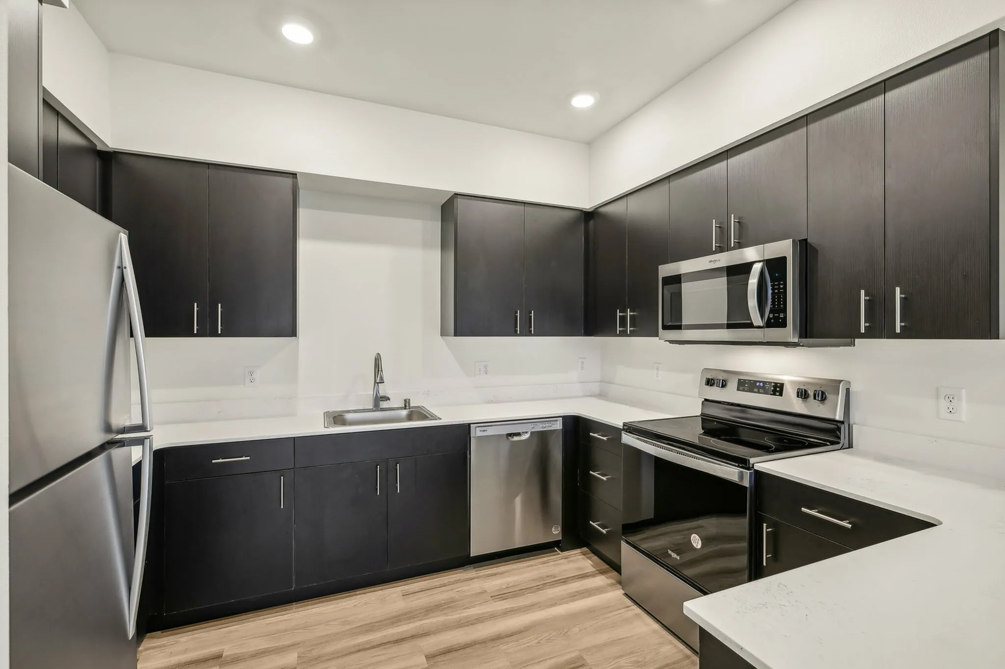 A huge chef's kitchen with ample storage and high-end appliances.