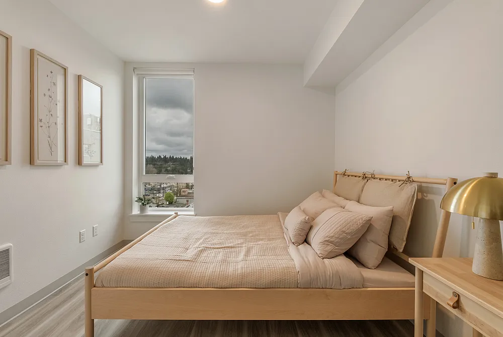 Bedroom at The Nook at Northaven featuring soft neutral tones, modern furniture, and large window with natural light.