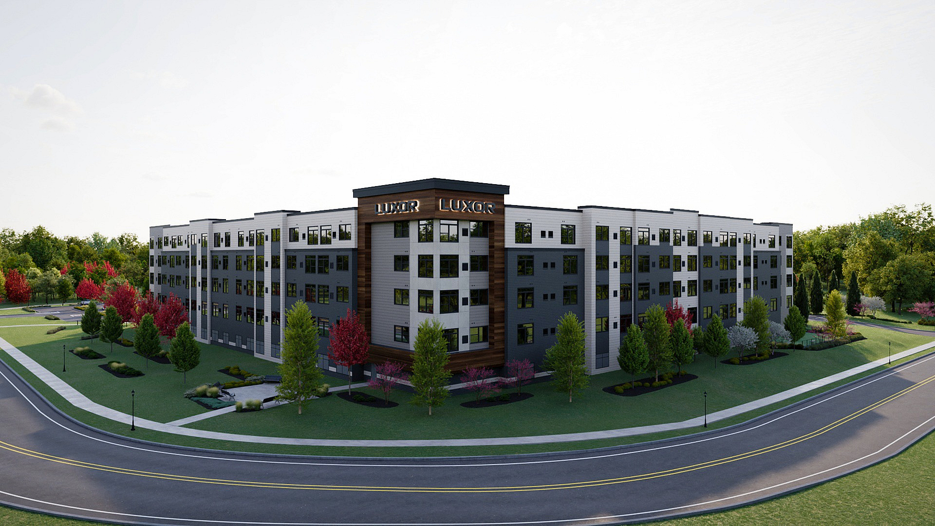 Modern five-story apartment complex with sleek design, surrounded by landscaped greenery and vibrant trees, offering a luxurious residential experience.