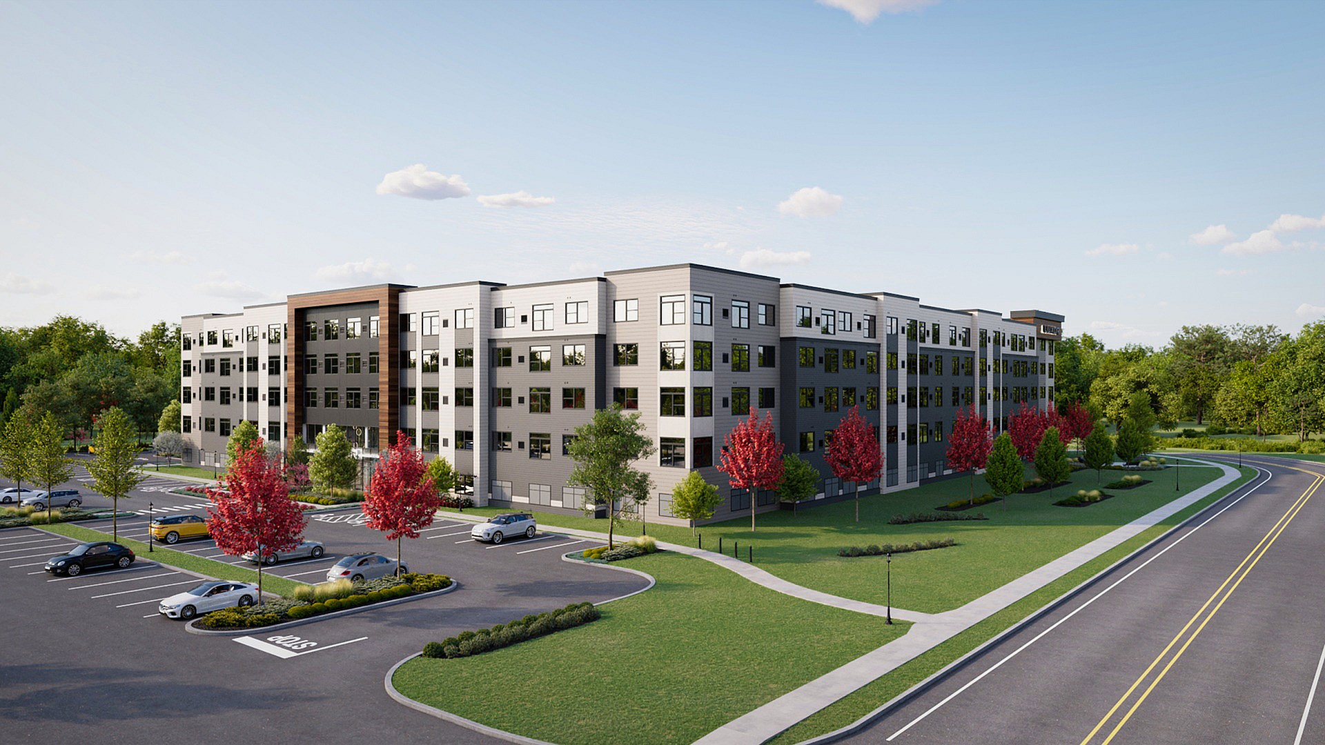Modern apartment complex with sleek design, surrounded by lush greenery and vibrant red trees, featuring ample parking and a peaceful suburban setting.