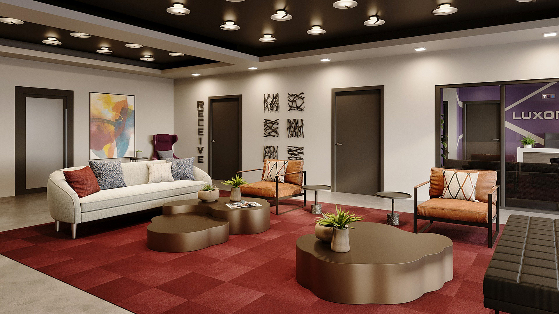 Stylish lobby area with modern decor, featuring a plush sofa, elegant seating, and chic coffee tables on a vibrant red carpet.