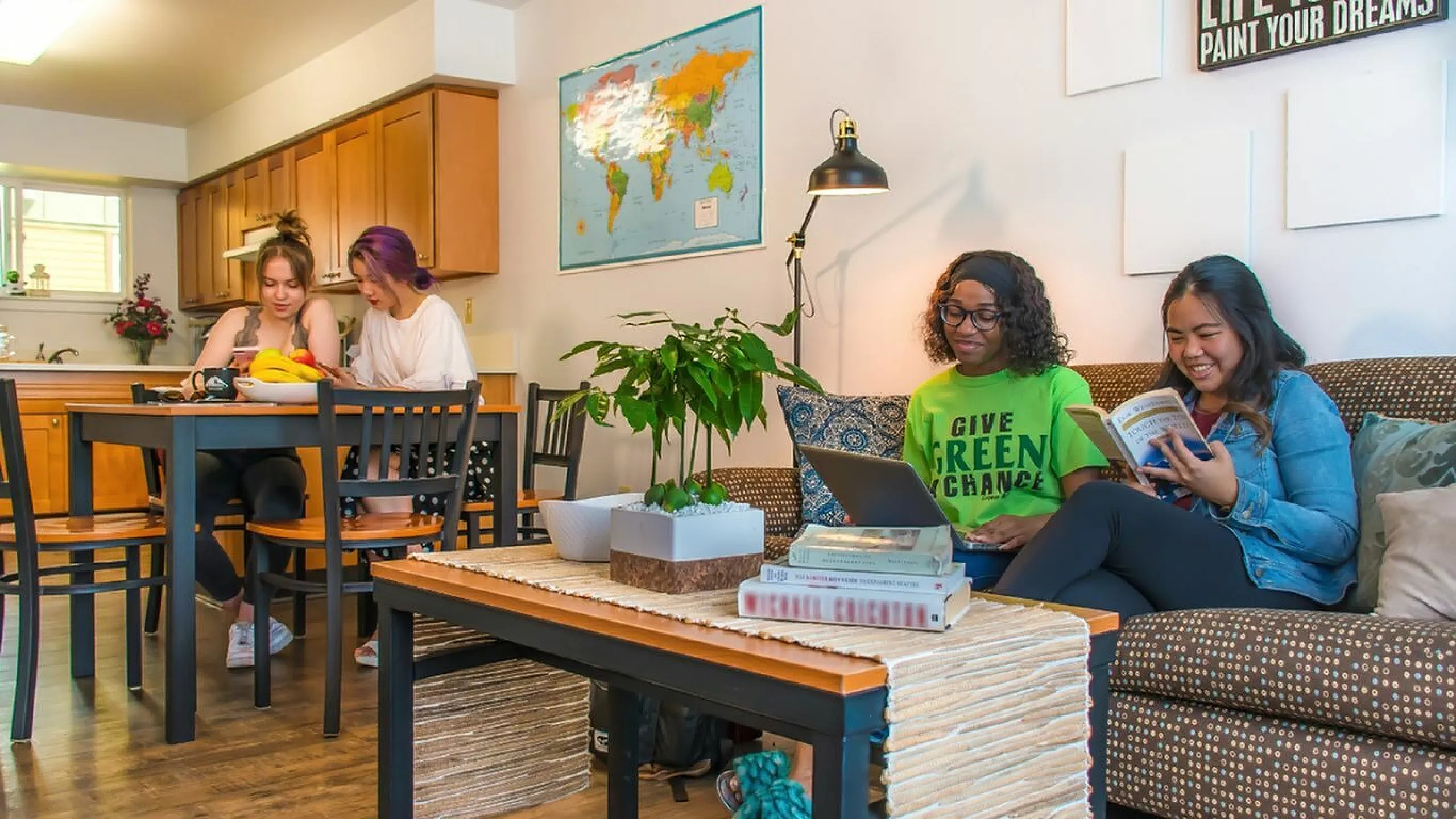 Inviting apartment space with cozy seating area and vibrant dining table perfect for socializing.