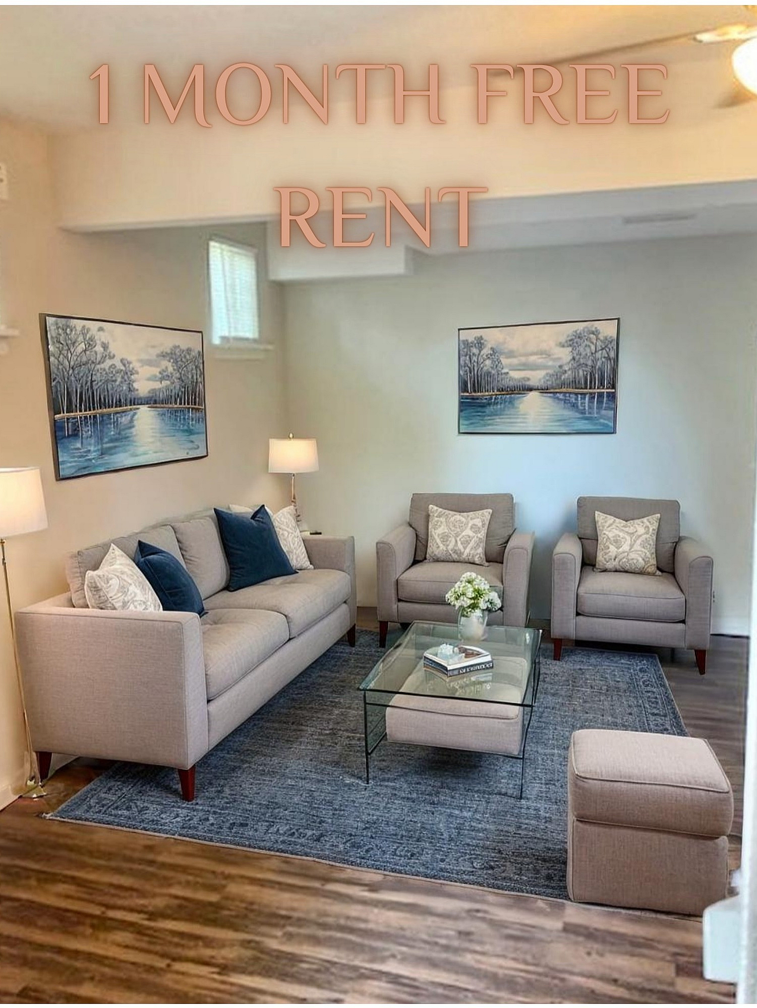 Inviting living room with elegant furniture, artful decor, and a cozy ambience offering 1 month free rent.