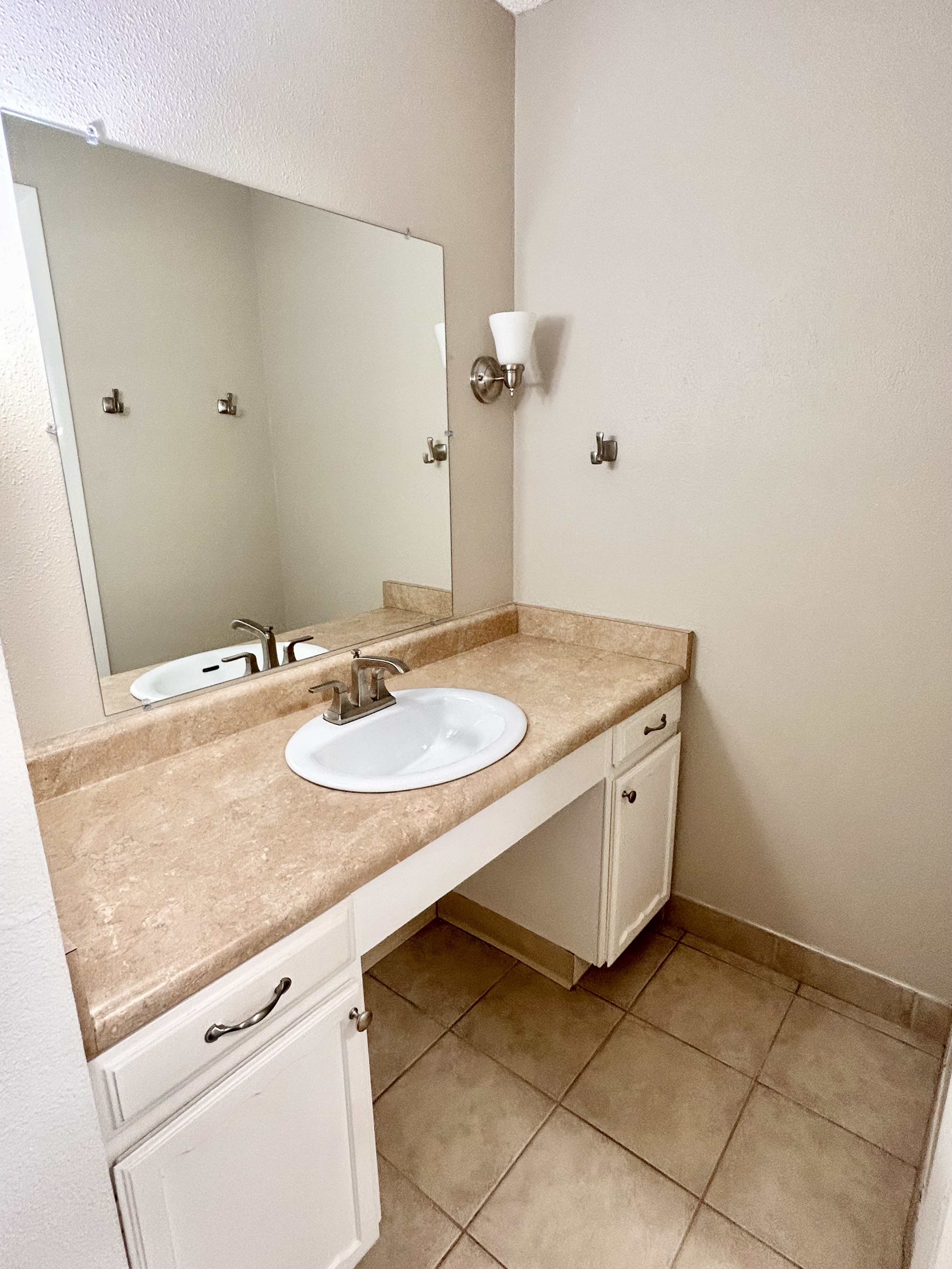 Elegant bathroom vanity with a sleek marble countertop and modern faucet.