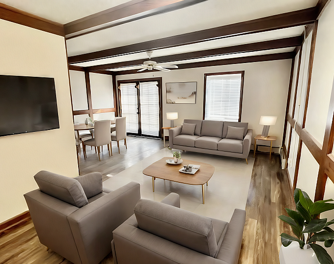 Inviting living room with modern grey seating, elegant dining area, and warm wood accents enhancing natural light.