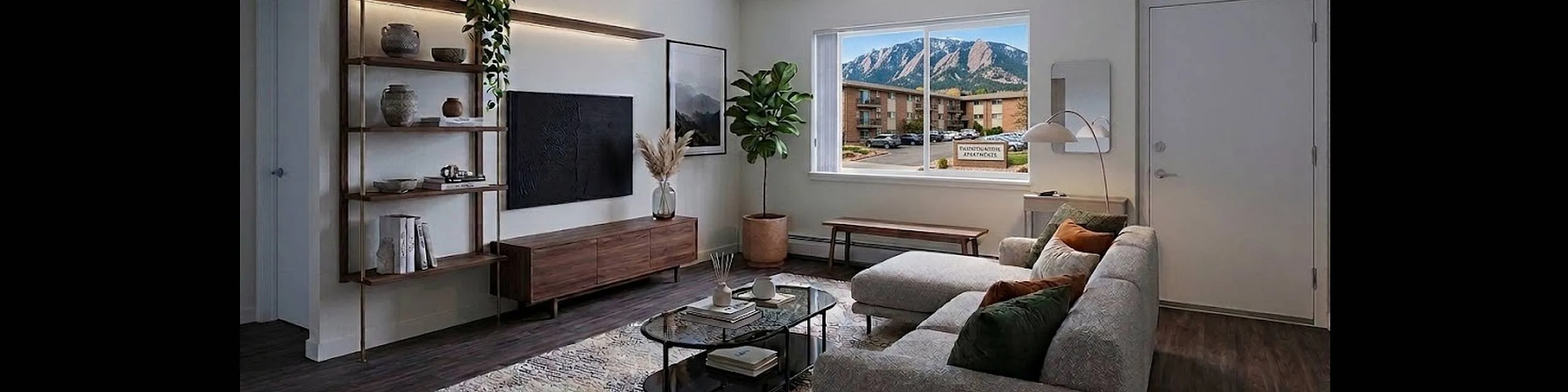 Chic apartment living room with modern decor, featuring a cozy sofa, sleek shelves, and a large window in denver, CO