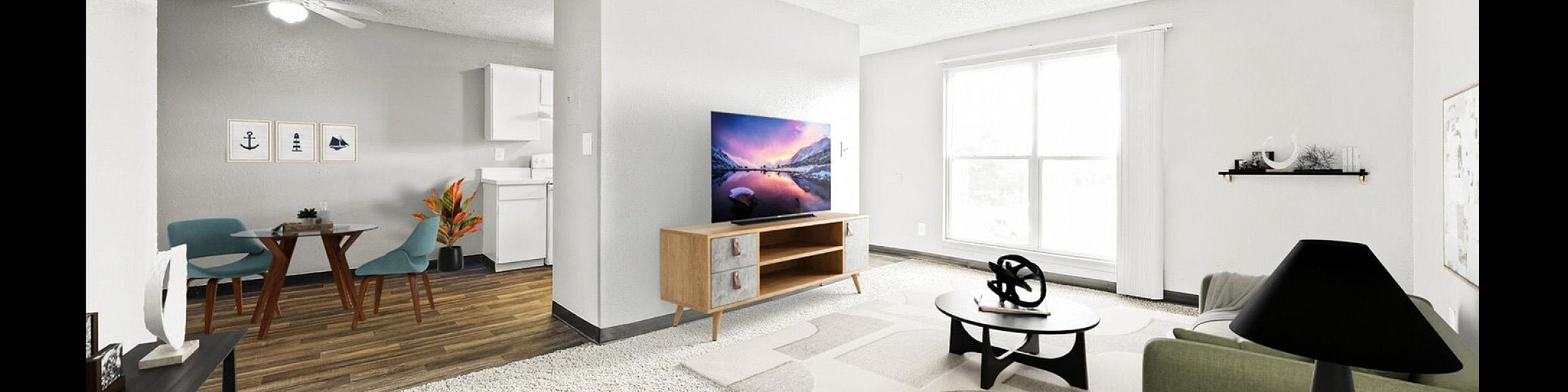 Modern, virtually staged living space featuring sleek furniture, a cozy carpeted area, and a bright, airy atmosphere. Open concept leads to a stylish dining area with contemporary touches and a well-appointed kitchen.