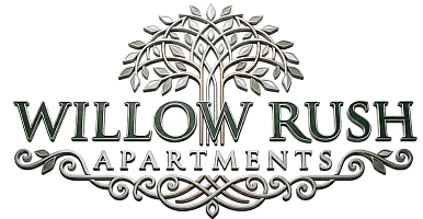 Elegant Willow Rush Apartments logo featuring a stylized tree with intricate branches and leaves.