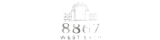 Elegant logo for 8867 West 54th Apartments featuring a stylized archway design, exuding modern sophistication.