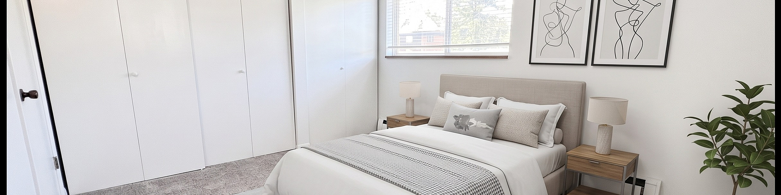 Bright and airy bedroom featuring a stylish bed, elegant decor, and large closet space with ample natural light through a window.