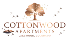 Elegant Cottonwood Apartments logo featuring a stylized tree and dandelions in Lakewood, Colorado.