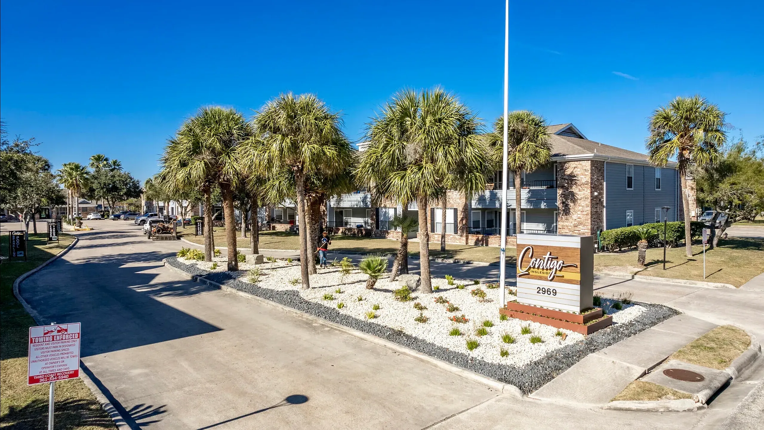 Elegant entrance of Contigo Ingleside Apartment Homes with beautiful brickwork