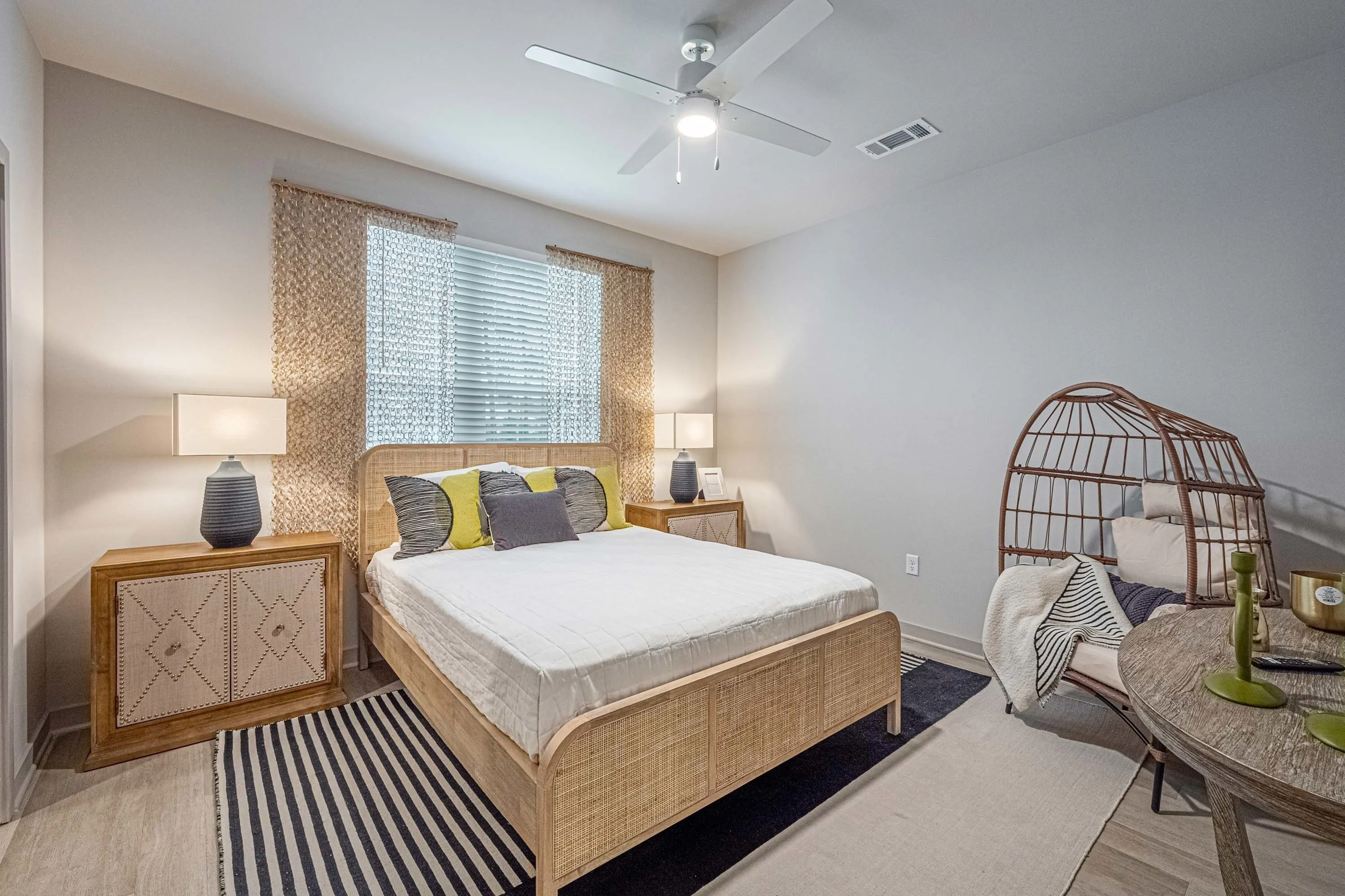 Furnished bedroom with bed and tables