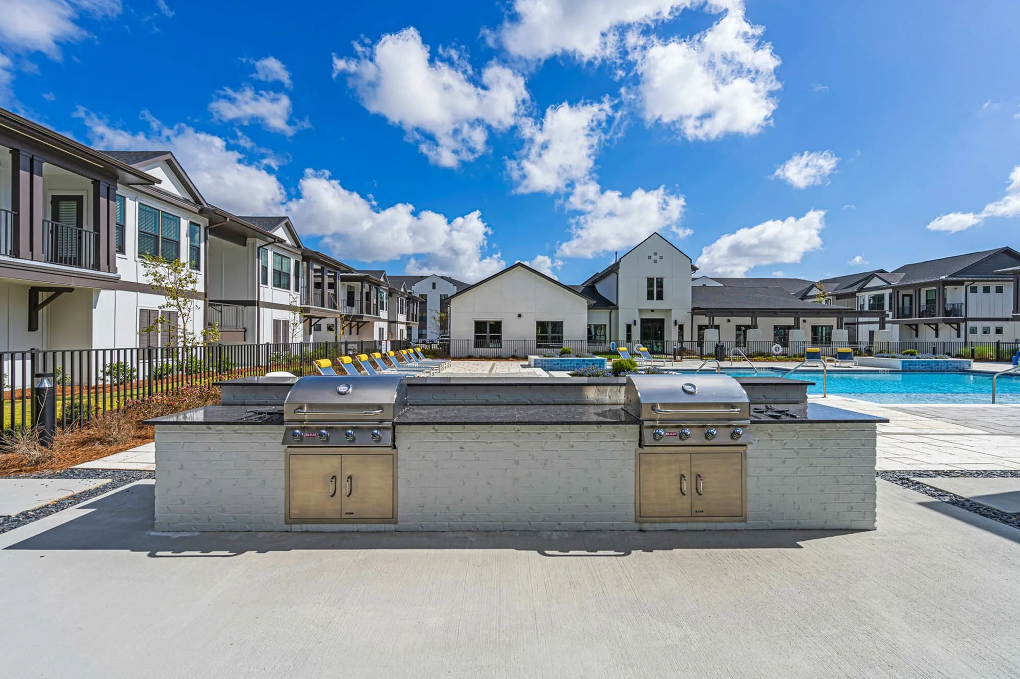 Outdoor grilling station next to pool