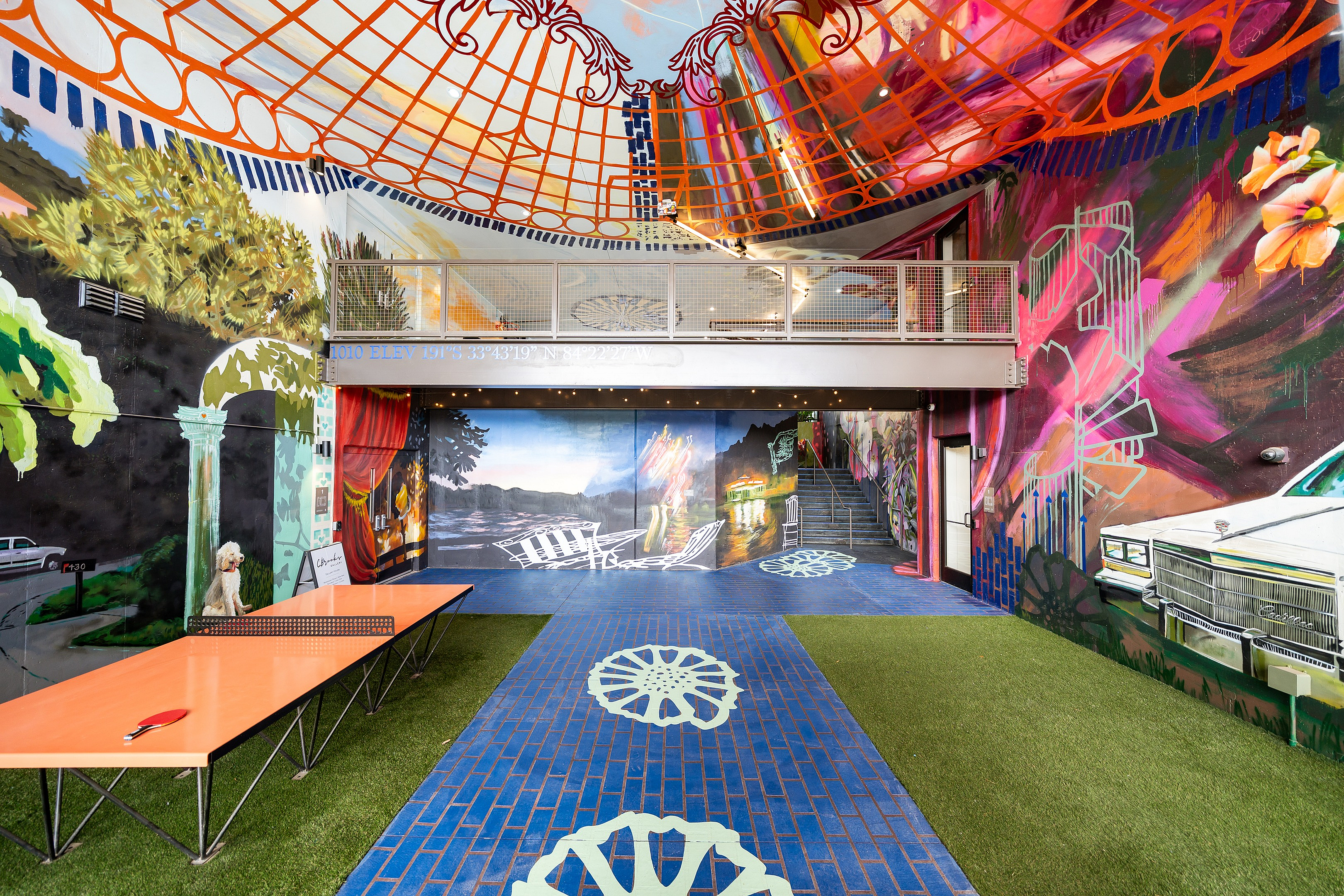 Vibrant and artistic apartment space featuring colorful murals and unique architecture, creating an inspiring and lively atmosphere for modern living.