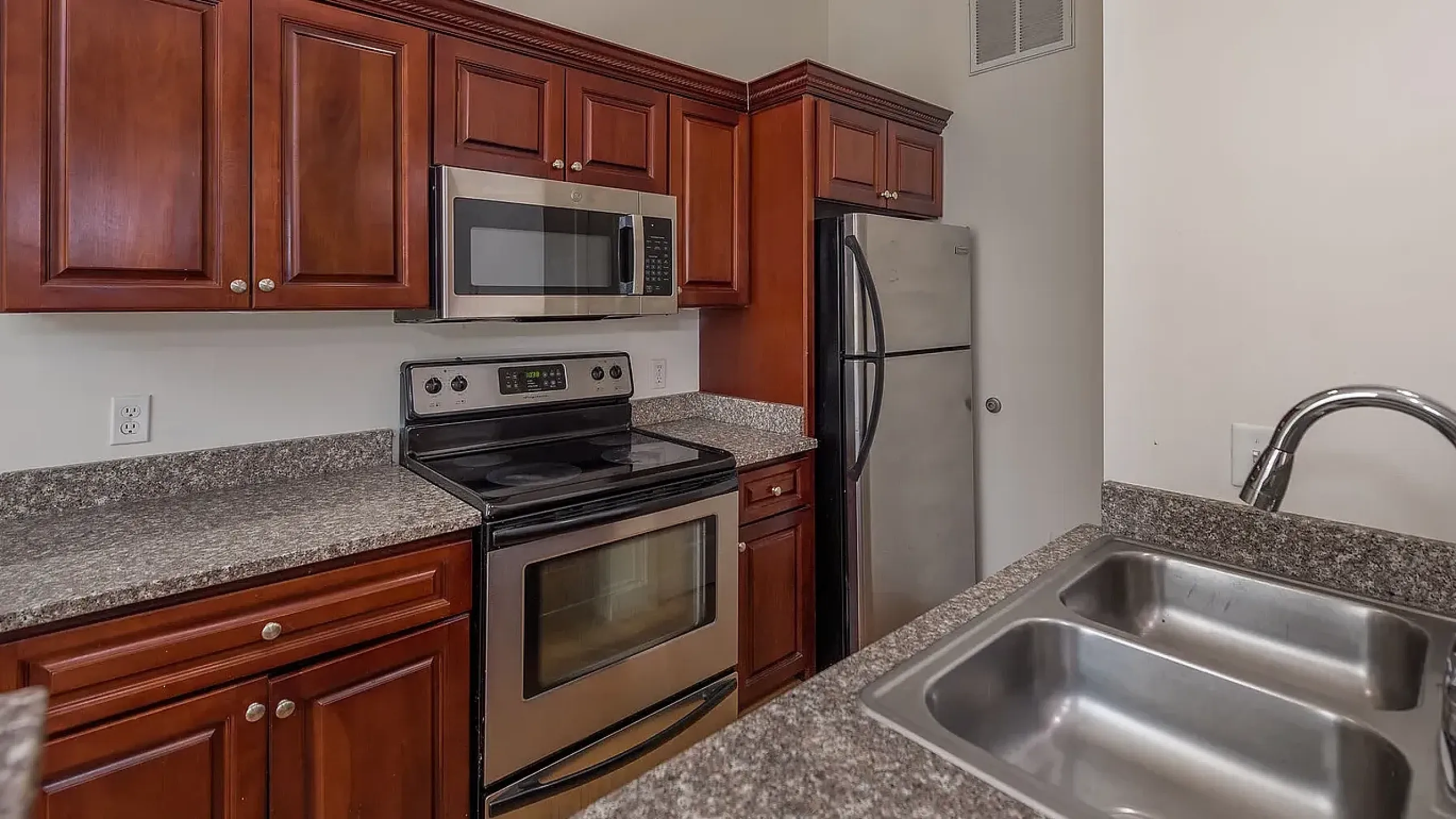 Distinctive historic apartment building with classic architecture, featuring large windows and a picturesque facade.