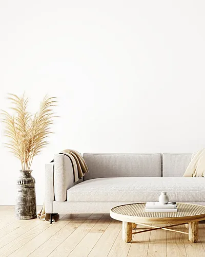 Sleek living room with modern sofa, neutral tones, and stylish decor elements.