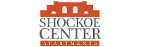 Elegant logo of Shockoe Center Apartments featuring a stylized building silhouette.