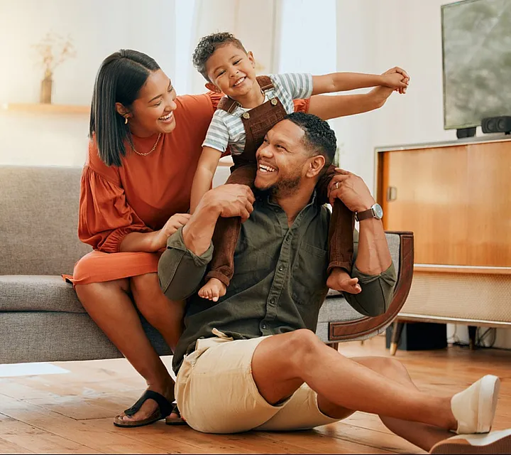 Happy family enjoying time together in a bright and modern living room.