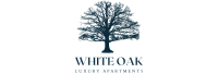 Elegant tree silhouette logo for White Oak Luxury Apartments.