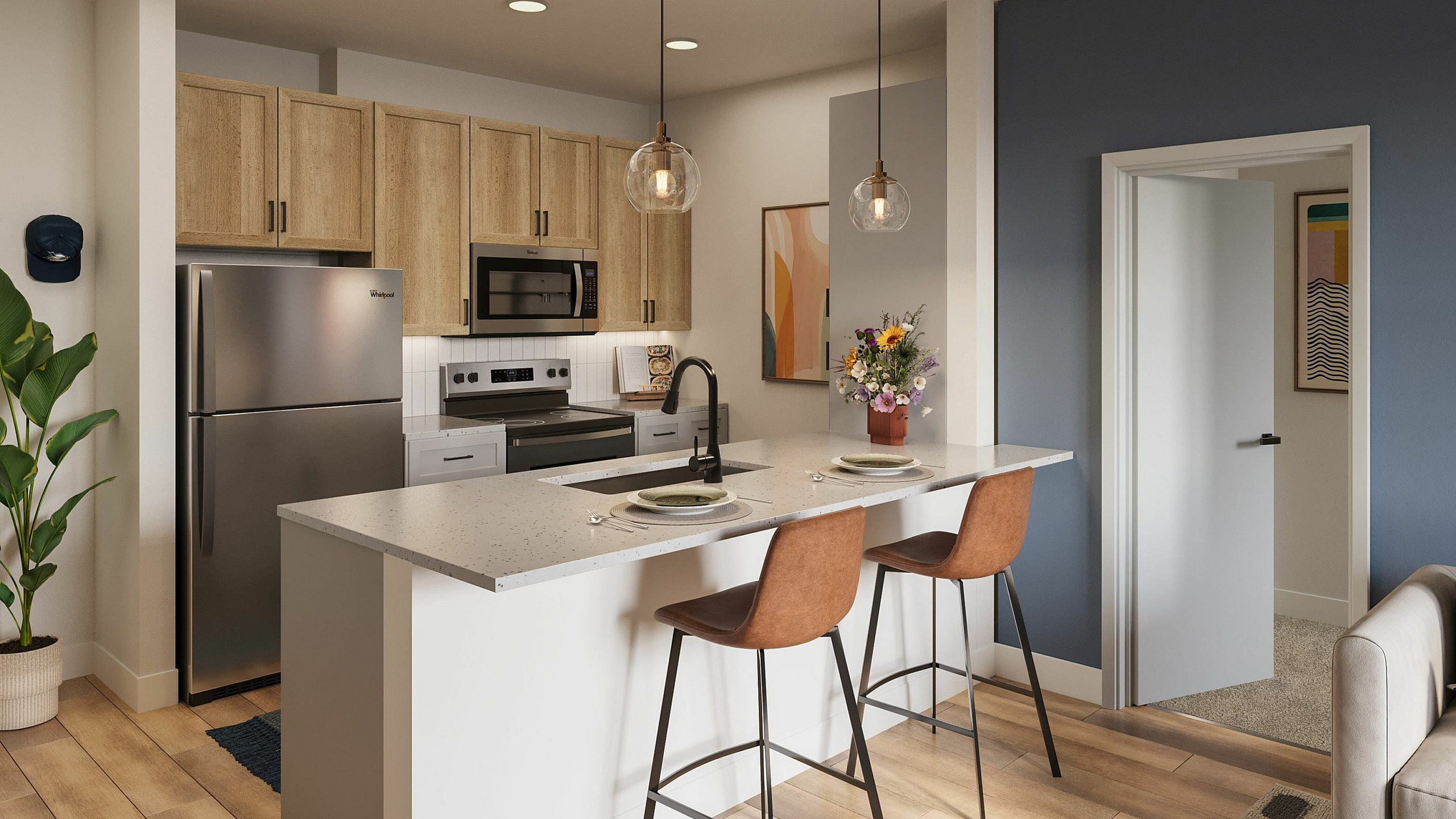 Chic open-concept kitchen with modern appliances, cozy seating, and stylish decor in a bright, welcoming apartment.