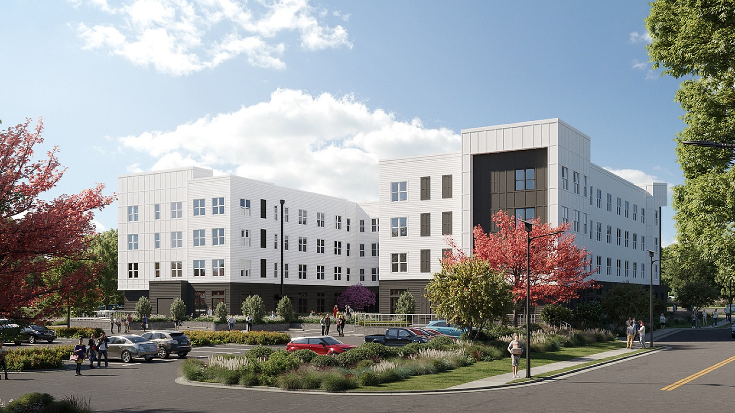 Modern apartment complex surrounded by lush greenery and vibrant landscaping, featuring sleek architecture and ample parking.