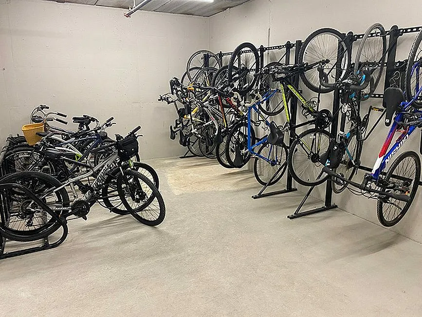 Modern apartment bicycle storage with organized racks for convenient and secure bike parking.