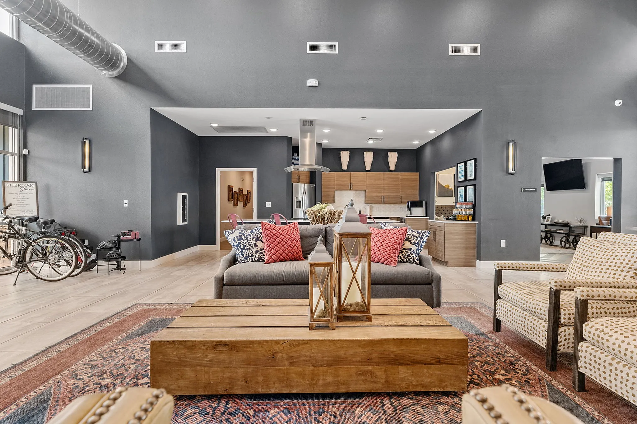 Stylish open-concept living area boasting modern furniture, sleek kitchen design, and ample natural light.