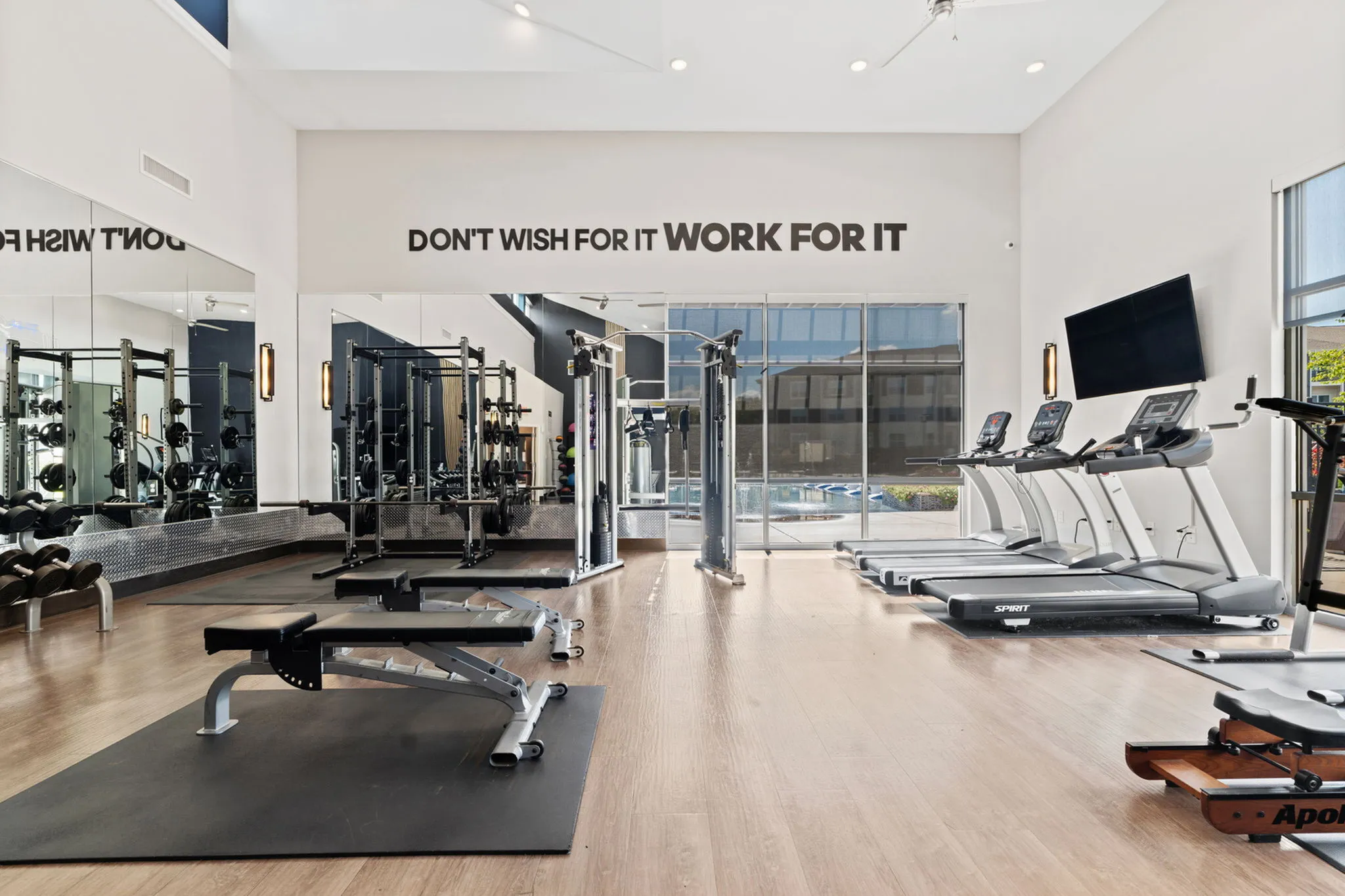 Modern fitness center featuring state-of-the-art equipment, sleek design, and motivational decor.