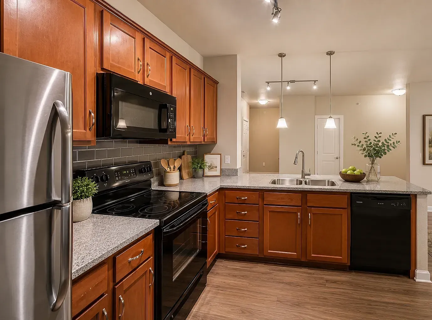 Modern and spacious kitchen with granite countertops and upgraded appliances.