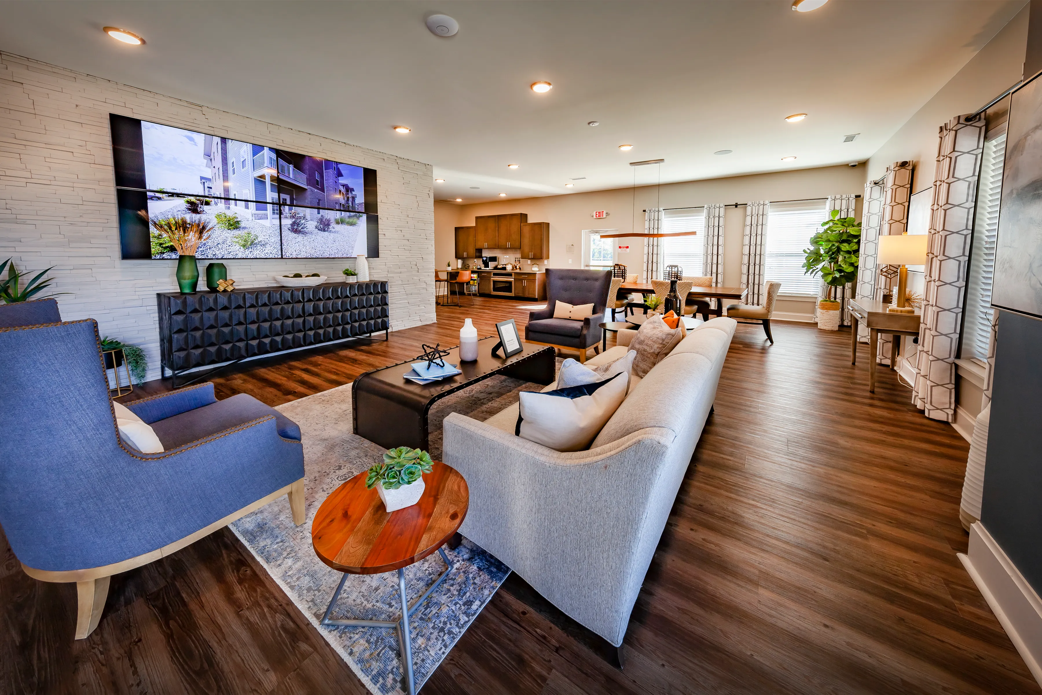Luxurious open-concept living space featuring modern decor, elegant seating areas, and a stylish dining nook, perfect for entertaining.