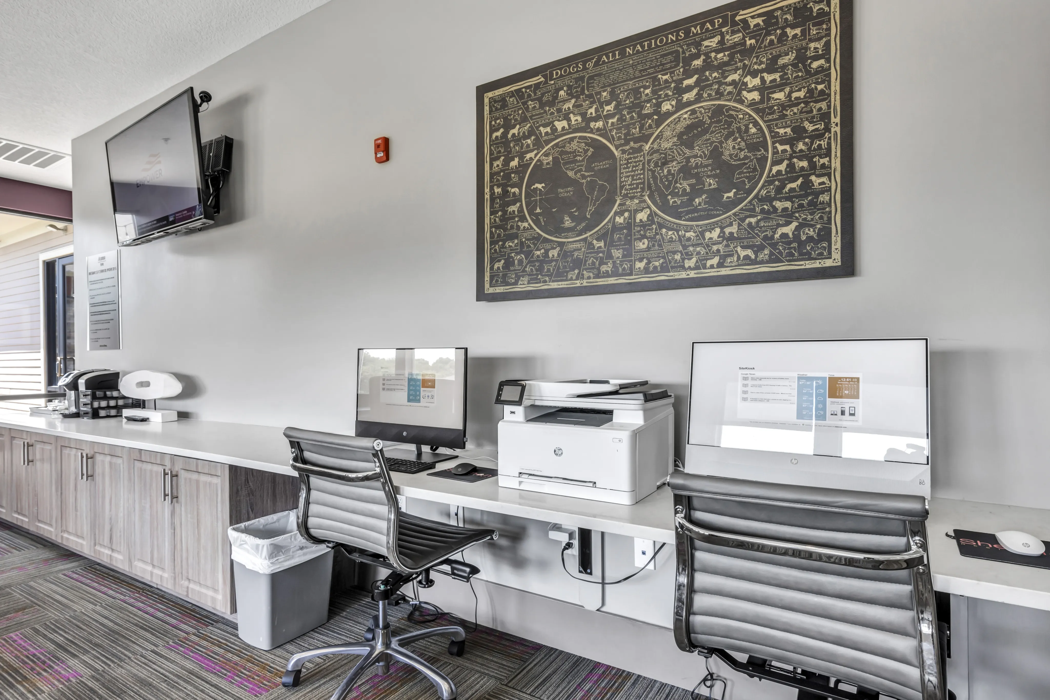 Modern and inviting office space with sleek workstations, a multifunction printer, and stylish decor.