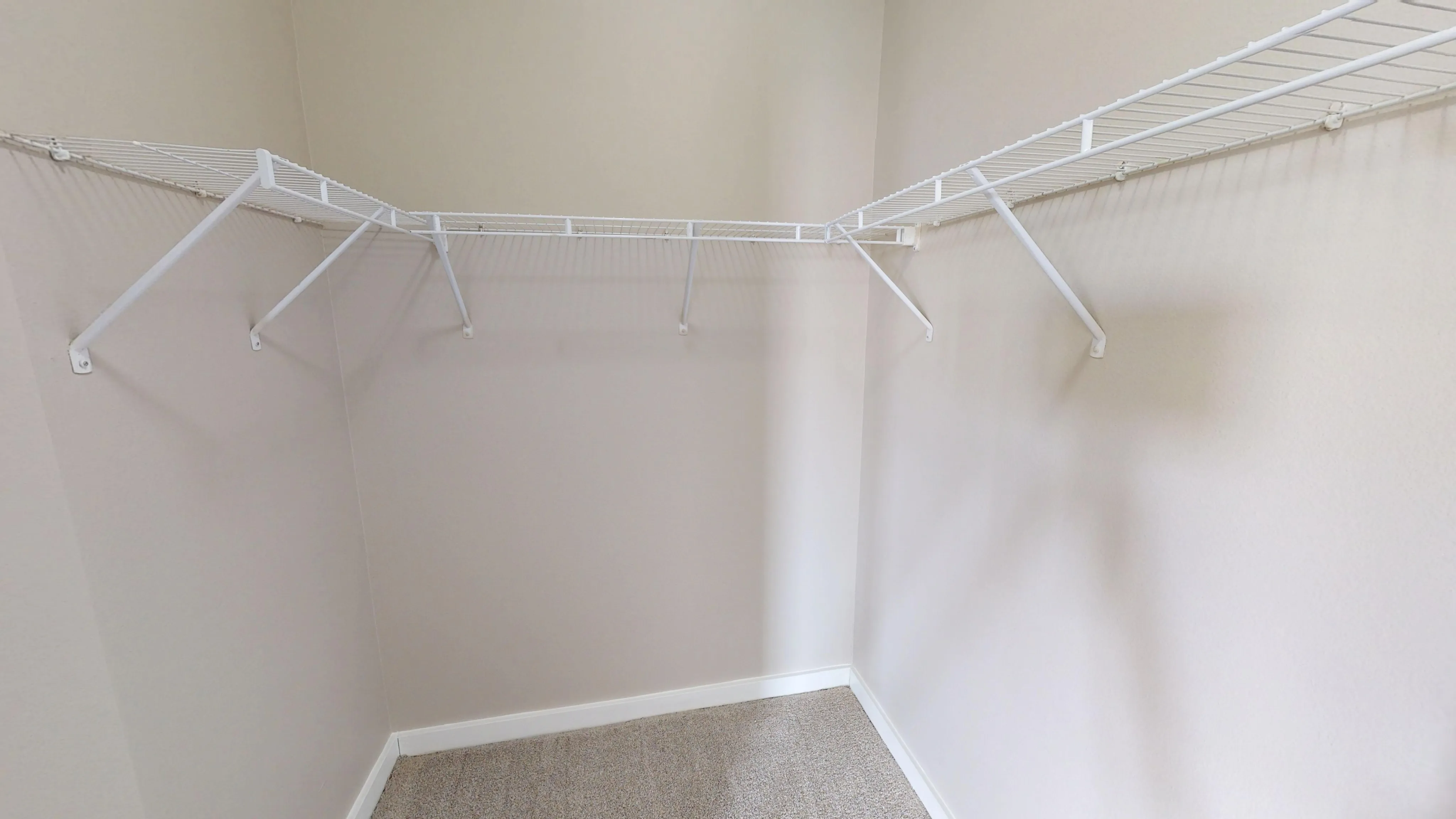 Spacious walk-in closet with ample shelving for an organized lifestyle.