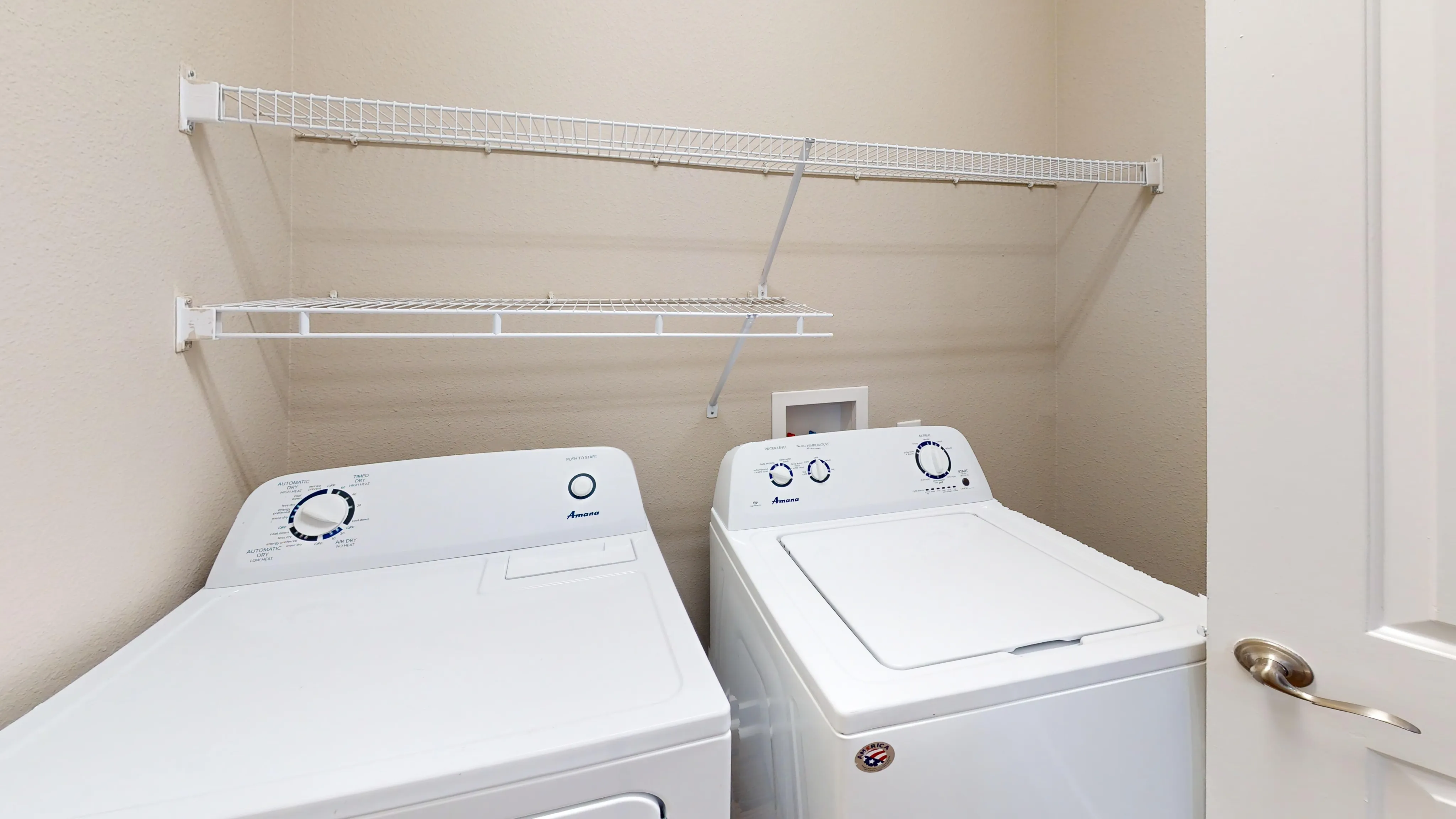 Convenient in-unit laundry space with modern washer and dryer, ideal for hassle-free living.