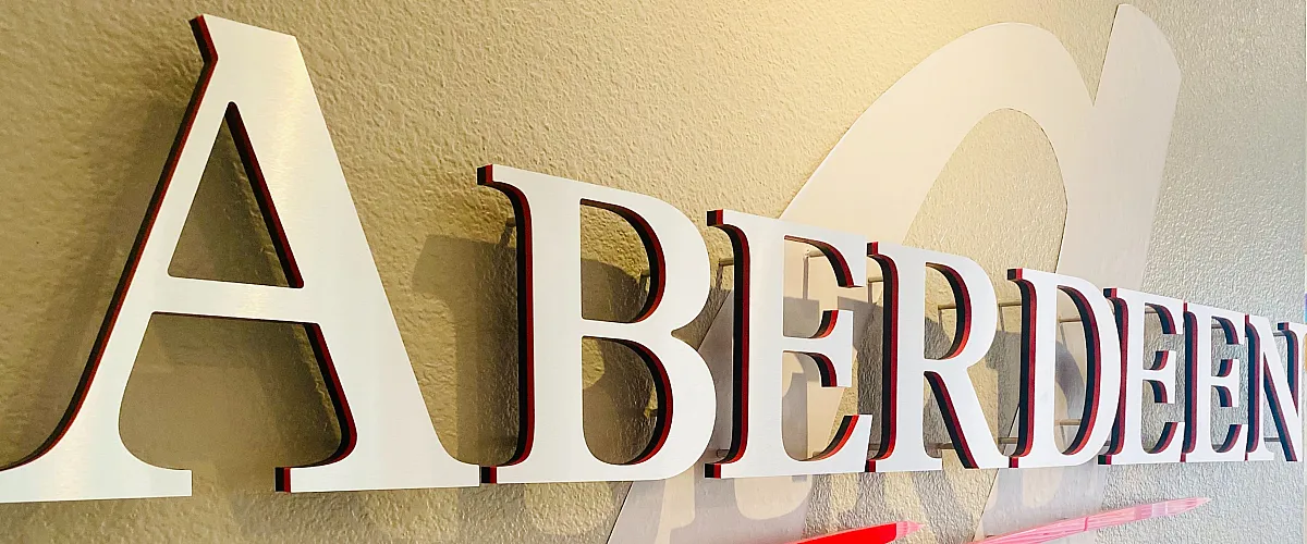 Elegant wall signage for Aberdeen Apartments showcases modern typography and design.