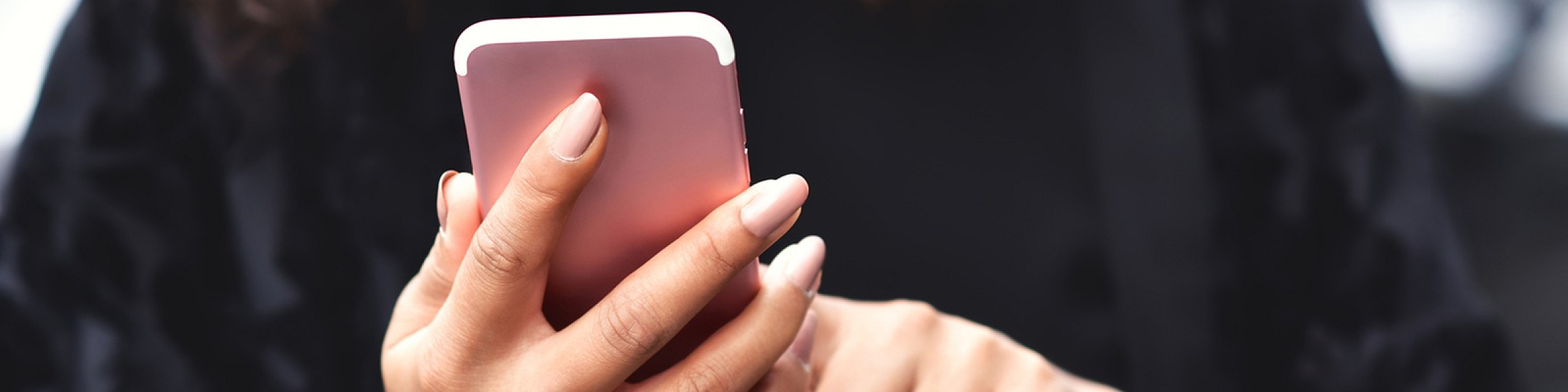 Person using a smartphone, demonstrating user engagement with modern technology.