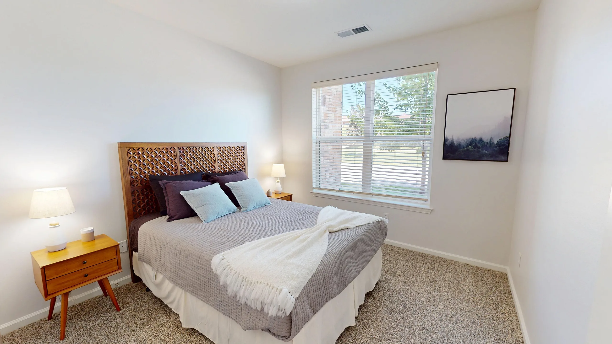 Spacious bedroom inside a two-bedroom apartment at Watermark at Jordan Creek in West Des Moines, Iowa.