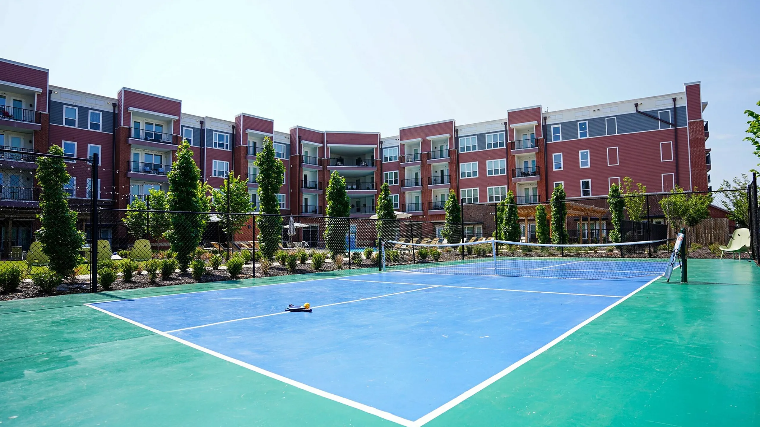 Outdoor pickleball court at Uptown Terrace Apartments.