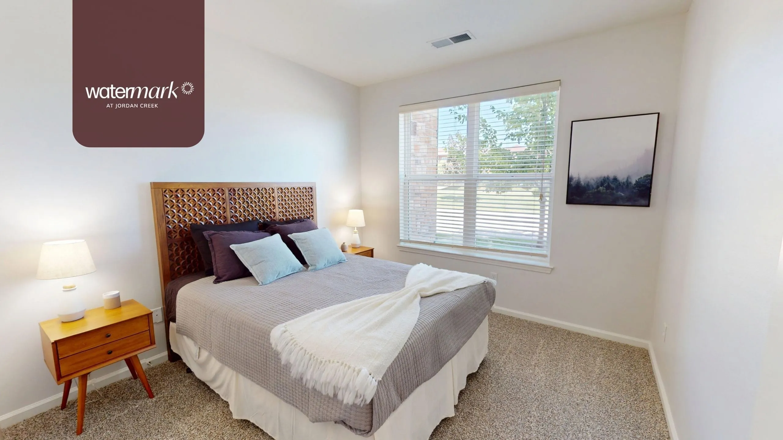 Modern, light-filled apartment bedroom at Watermark at Jordan Creek.