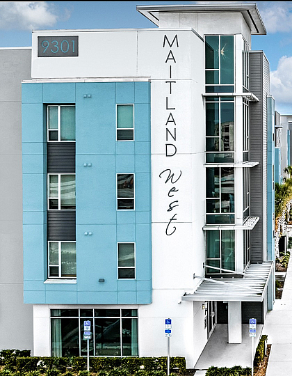 Contemporary apartment building with modern architecture and well-maintained surroundings.