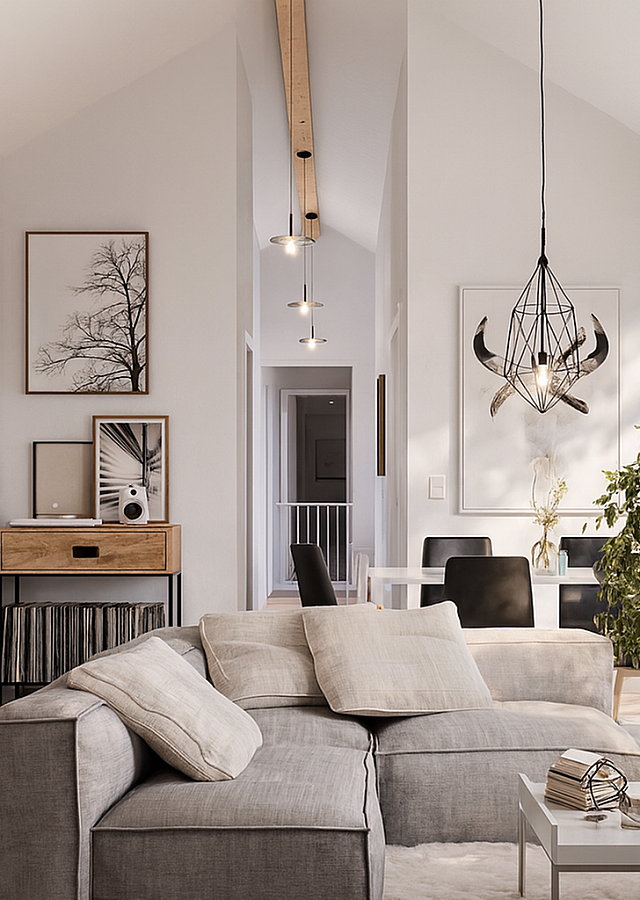 A bright, modern living room and dining area with vaulted ceilings, light wood flooring, a soft gray sectional sofa, minimalist d&eacute;cor, and natural sunlight highlighting the clean, contemporary design of a stylish Los Angeles apartmen