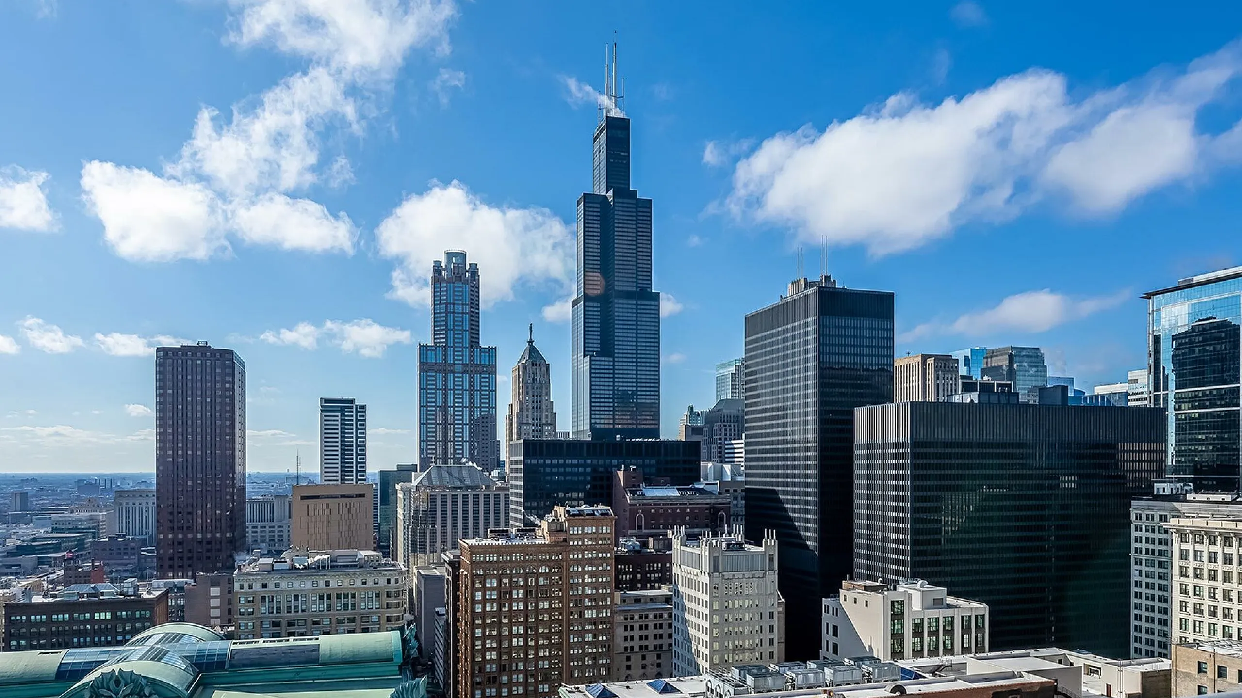Captivating city skyline with modern skyscrapers under a clear blue sky, offering breathtaking urban views.