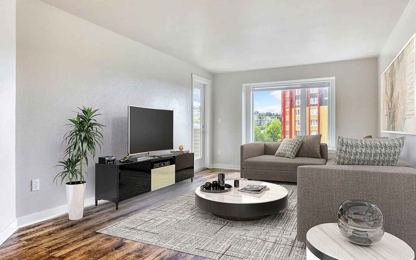 Inviting modern living room with sleek hardwood floors, stylish gray sofas, and a large window offering a vibrant city view.
