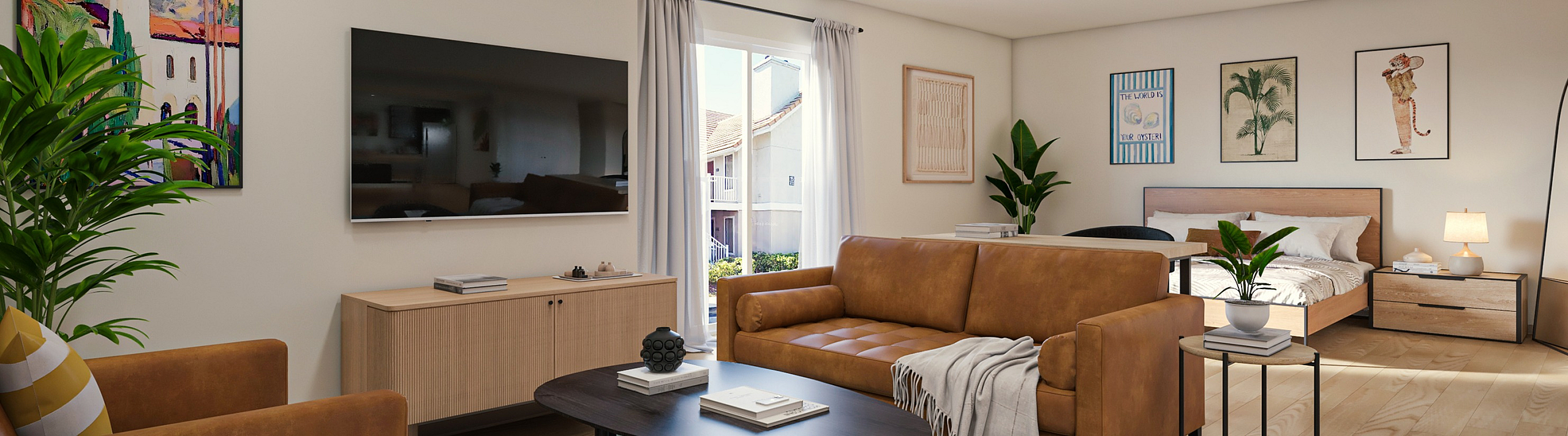 Modern open-plan living room with stylish decor featuring a cozy leather sofa, vibrant artwork, and a sleek wall-mounted TV adjoining a serene bedroom area.