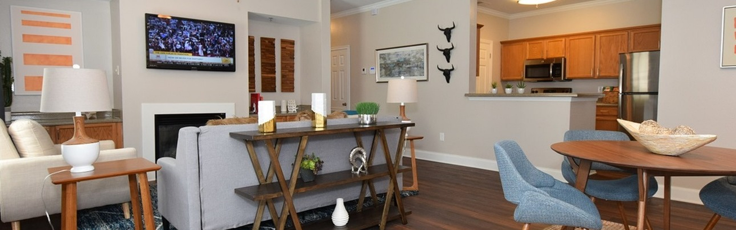 Modern open-concept living space featuring cozy seating, elegant dining area, and stylish kitchen with sleek appliances.