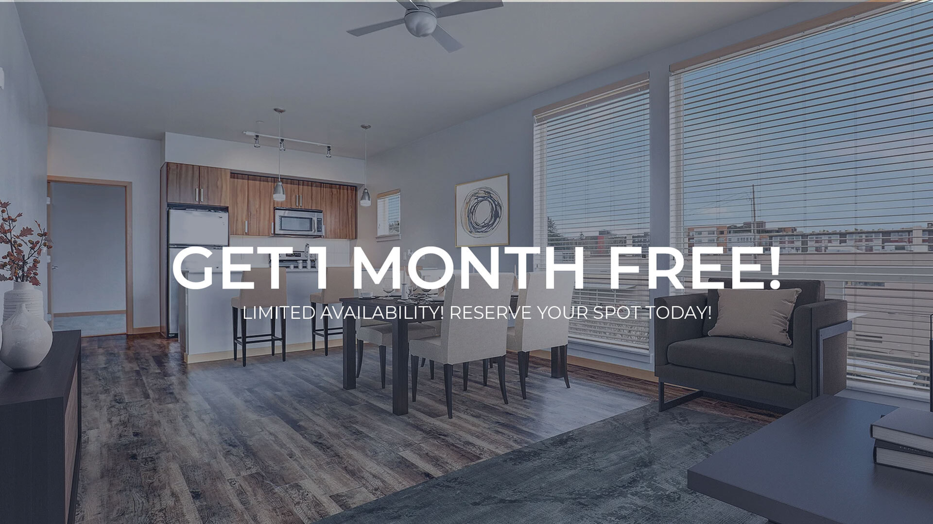 Inviting modern apartment with open-concept living area, stylish kitchen, and floor-to-ceiling windows offering city views. Limited offer: Get 1 month free!