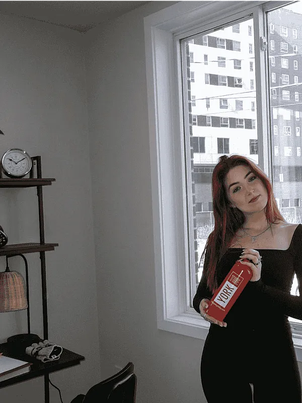 Female Student with York Water Bottle